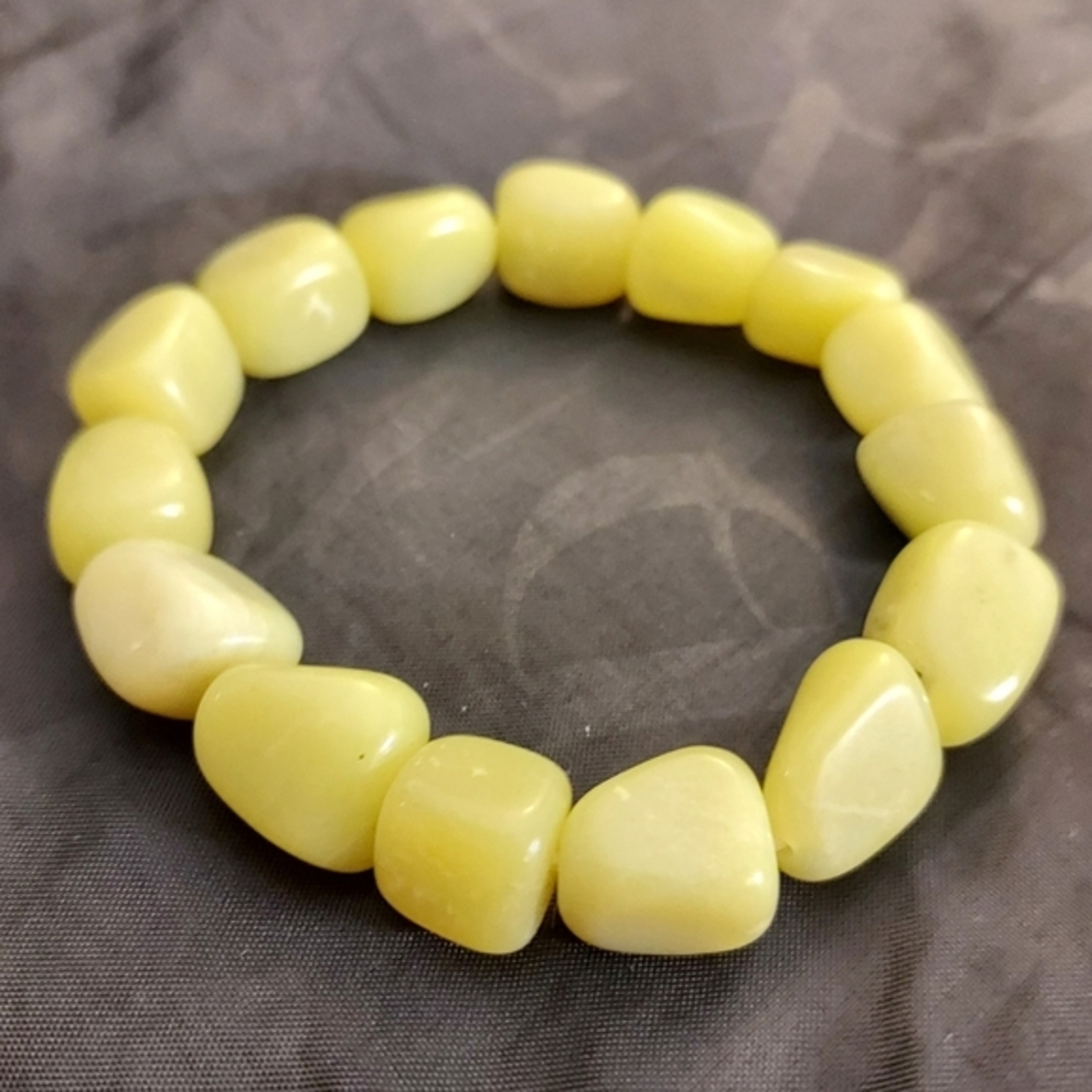 Handmade green yellow polished baltic amber rustic stretch bracelet